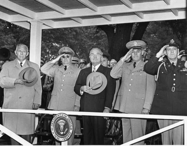 President Harry S. Truman and military leaders reviewing troops during the first Armed Forces Day parade, Washington D.C., 20 May 1950.