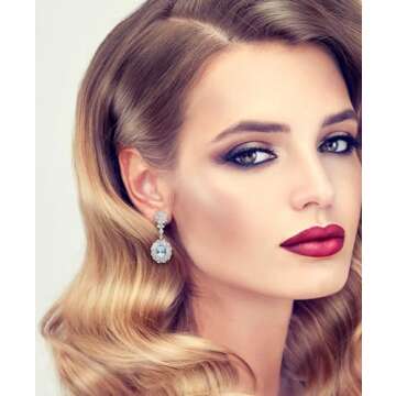 Dangling Earrings, Aquamarine 3.07 Carat Adjacent Natural Baguette and Round Brilliant Diamonds 4.03 Carat. Set in 18K White Gold.