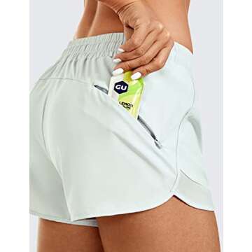 CRZ YOGA Women's Mid Rise Running Shorts Mesh Liner 3'' - Quick Dry Drawstring Workout Athletic Gym Shorts Zip Pocket Coconut Milk White Medium
