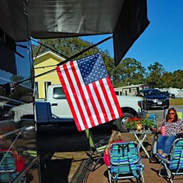 The Traveler RV Flag Pole Kit. Includes12"x18" Inch Flag, 24” Inch Flag Pole With Adjustable Angle Suction Cup Mount And Storage Bag.