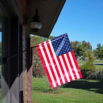 The Traveler RV Flag Pole Kit. Includes12"x18" Inch Flag, 24” Inch Flag Pole With Adjustable Angle Suction Cup Mount And Storage Bag.