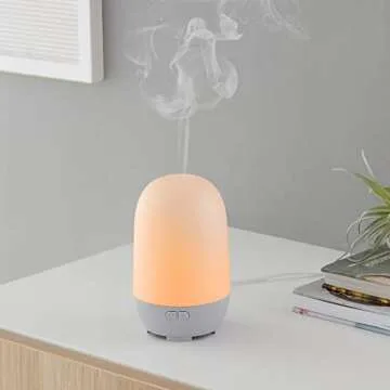 Amazon Basics 100ml Ultrasonic Aromatherapy Essential Oil Diffuser, Light Grey Base, with 7-Color Night Light