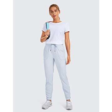 CRZ YOGA Women's Lightweight Golf Pants with Pockets Casual Joggers Workout Lounge Running Travel Pants with Zipper Ankle Light Grayish Blue Medium