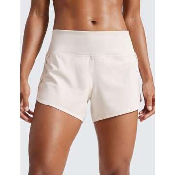 CRZ YOGA Mid Waisted Running Shorts for Women Soft for Gym Athletic Workout with Zipper Pocket Liner Quick Dry Milky White (Bone) Medium