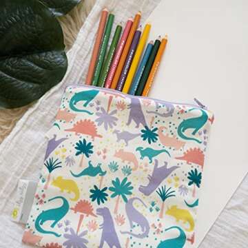 Itzy Ritzy Reusable Snack Bag – 7” x 7” BPA-Free Snack Bag is Food Safe, Washable and Ideal for Storing Snacks, Pacifiers, Electronics and Makeup in a Diaper Bag, Purse or Travel Bag, Purple Dinosaur