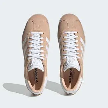 adidas HALBLU/FTWWHT/CBLACK Women's Gazelle W Halo blushFtwr White/Core Black 7.5 US, Wide