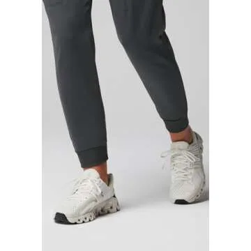 Fabletics Women's High Rise Active Scrub Jogger - MotionTech, 4-Way Stretch, Pocket-Packed, Lightweight, Semi-Slim Fit, L/Tall 31 in | 31, Onyx