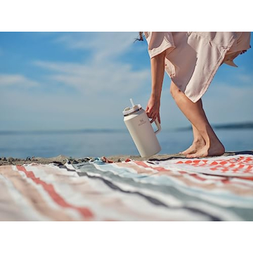 Stanley Quencher H2.0 FlowState Stainless Steel Vacuum Insulated Tumbler with Lid and Straw for Water, Iced Tea or Coffee, Smoothie and More, Cream, 64 oz