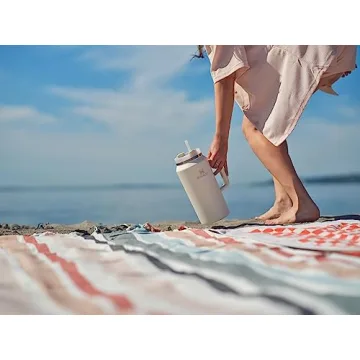 Stanley Quencher H2.0 FlowState Stainless Steel Vacuum Insulated Tumbler with Lid and Straw for Water, Iced Tea or Coffee, Smoothie and More, Cream, 64 oz