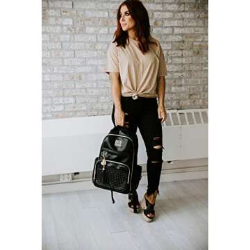 Itzy Ritzy Chelsea + Cole Diaper Bag Backpack - Studded Boss Backpack Diaper Bag Includes 19 Pockets, Changing Pad, Stroller Clips & Tassel; Black with Sweetheart Print Interior & Gold Hardware