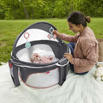 Fisher-Price Portable Bassinet On-The-Go Baby Dome, Travel Play Space with Developmental Newborn Toy...
