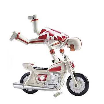 Disney Pixar Toy Story 4 Stunt Racer Duke Caboom Figure, 5.9 in, in Racing Outfit with Motorcycle and Launcher, Race Up to 15 ft and Perform Stunts, Gift for 3 Years and Older