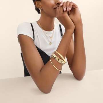 Elegant Coach Women's Heart Huggie Earrings in Gold