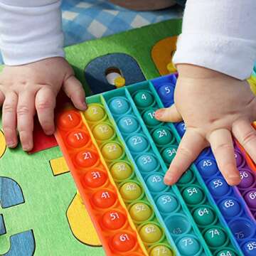 AK-SHIP 7.8in Big Size P0pp Math Toys , Rainbow Square Fidget Ttoy 100bubbles Stress Relieving Fidget Game for Teachers to Create Kinds of Math Manipulatives【with 1-100 Numbers Tables】