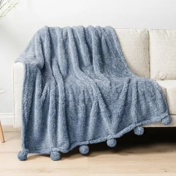 PAVILIA Blue Sherpa Throw Blanket for Couch, Warm Plush Pom Pom Blanket Throw, Dusty Blue Fuzzy Sofa Throw, Lightweight Soft Cozy Fluffy Blanket with Pom Poms, Light Blue, 50x60