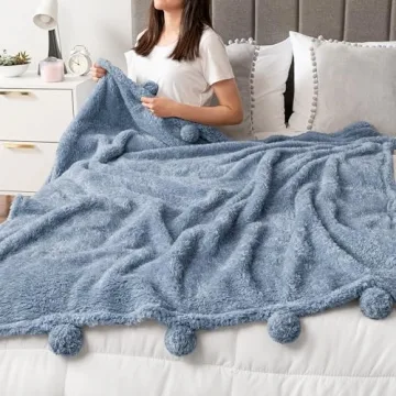 PAVILIA Blue Sherpa Throw Blanket for Couch, Warm Plush Pom Pom Blanket Throw, Dusty Blue Fuzzy Sofa Throw, Lightweight Soft Cozy Fluffy Blanket with Pom Poms, Light Blue, 50x60