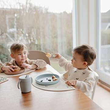 mushie Silicone Baby Bib | Adjustable Fit Waterproof Bibs (Whales)