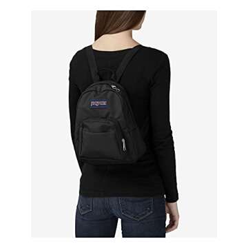 JanSport Half Pint Mini Backpack for Women, Men, Girls, Boys, Black, 10.2 L - Durable Mini Bag Purse with Adjustable Shoulder Straps, Single Main Compartment, Zippered Stash Pocket