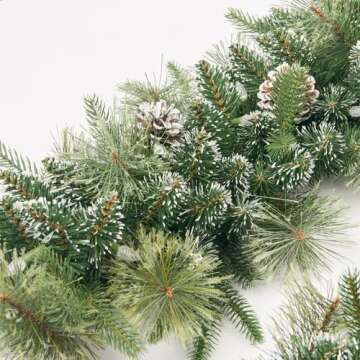 AMERZEST Christmas Garland Pre-lit 9 Ft with 50 Led Lights, Battery Operated Fireplace Stairs Mantle Door Indoor Outdoor, Decorated Pine Cone and Snow Style