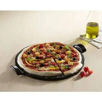 Emile Henry Made in France Flame Top Pizza Stone, Black. Perfect for Pizzas or Breads. In the Oven, On Top of the BBQ. Safe up to 750 degrees F. 100% Natural Clay, Glazed Surface. Easy to Clean.