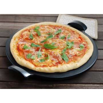 Emile Henry Made in France Flame Top Pizza Stone, Black. Perfect for Pizzas or Breads. In the Oven, On Top of the BBQ. Safe up to 750 degrees F. 100% Natural Clay, Glazed Surface. Easy to Clean.