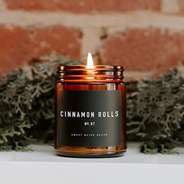 Sweet Water Decor Cinnamon Roll Candle - Christmas Candle with Cinnamon, Icing & Buttery Pastry for Home - Cinnamon Soy Candle with 40 Hours Burn Time - 9Oz Black Lid Amber Jar Cinnamon Scents