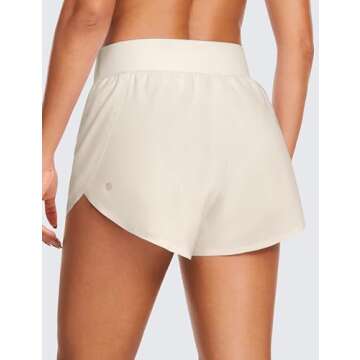 CRZ YOGA High Waisted Dolphin Athletic Running Shorts for Women 3" High Split Comfy Mesh Liner for Gym Workout Track White Apricot Medium