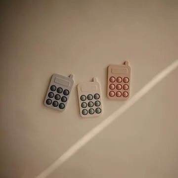 Mushie Phone Press Toy for Sensory Fun and Learning