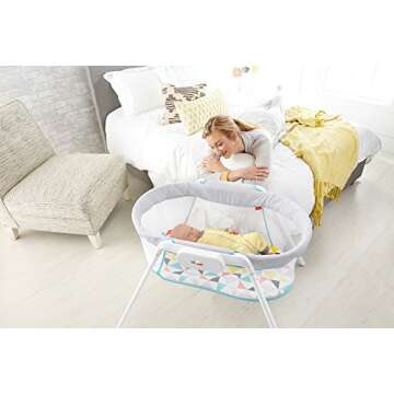 Fisher-Price Stow 'n Go Bassinet Windmill, portable baby cradle with soothing features for infants and newborns