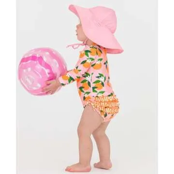 RuffleButts Baby Girls UPF 50+ Sun Protection Novelty Print Long Sleeve One Piece Rash Guard Swimsuit with Zipper - Orange You The Sweetest, 12-18m
