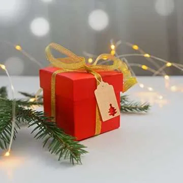 G2PLUS Christmas Gift Tags with String, 100PCS Kraft Paper Christmas Gift Tags, Hollow Christmas Tree Gift Tags, Xmas Present Hanging Name Tags for Christmas, Gift Wrapping, Party Decor (2'' x 4'')