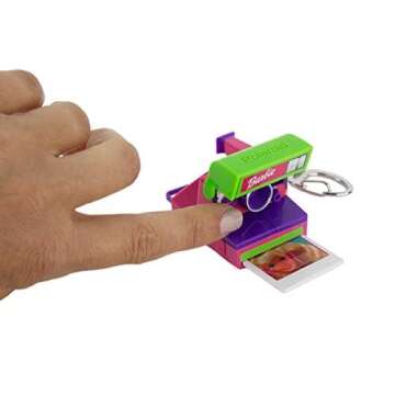 World's Coolest Barbie Polaroid, Retro Mini Novelty Camera, Measures only 1.5 x 2.25 x 1.75 inches has Sound, Simulated Film, and a clickable red Shutter Button, Ages 8+