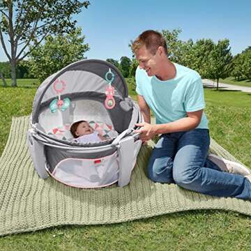Fisher-Price Portable Bassinet On-The-Go Baby Dome, Travel Play Space with Developmental Newborn Toy...
