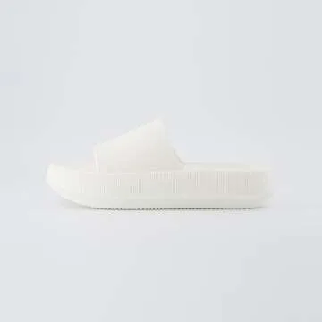 CUSHIONAIRE Feather Slides – Comfortable Cloud Cushion House Slippers for Women, Indoor Outdoor EVA Foam Foot Spa Shower Shoes, Non-Slip Arch Support, VANILLA 9