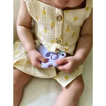 Itzy Ritzy Sensory Popper Toy for Babies - Itzy Pop Toy Features Raised Textures to Soothe Sore Gums, Relieve Stress & Improve Motor Skills - Baby & Toddler Fidget Toy for 3 Mo. & Up (Purple Dinosaur)