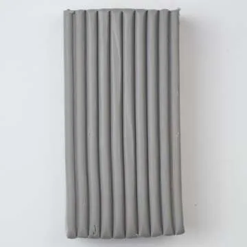 Super Sculpey Medium Gray, Premium, Non Toxic, Medium firmness, Sculpting Modeling Polymer clay, Oven Bake Clay, 1 pound bar. Great for all advanced sculptors, model makers and movie studios