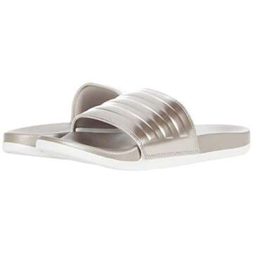 adidas Women's Adilette Comfort Slides Sandal, Champagne Metallic/Champagne Metallic/Crystal White, 11