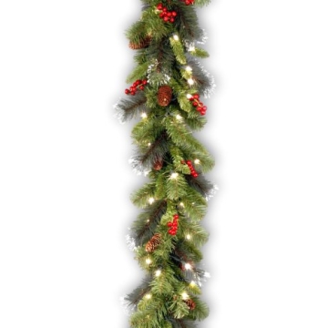 National Tree Company Pre-Lit Artificial Christmas Garland, Green, Crestwood Spruce, White Lights, Decorated with Pine Cones, Berry Clusters, Plug In, Christmas Collection, 9 Feet