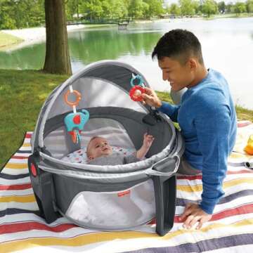 Fisher-Price Portable Bassinet On-The-Go Baby Dome, Travel Play Space with Developmental Newborn Toys & Canopy, Arrows Away