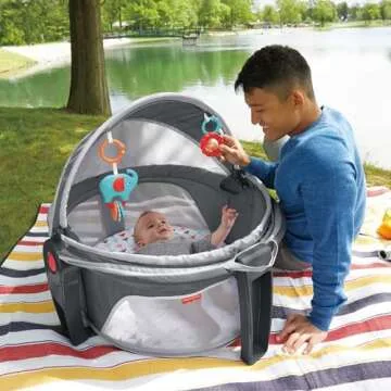 Fisher-Price Portable Bassinet On-The-Go Baby Dome, Travel Play Space with Developmental Newborn Toys & Canopy, Arrows Away