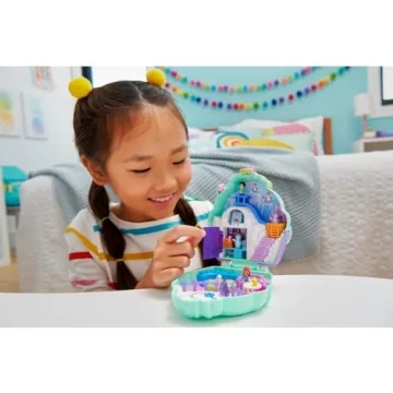 Polly Pocket Dolls & Playset, Snow Sweet Penguin Compact with 13 Accessories, Travel Toy with Fidget Exterior