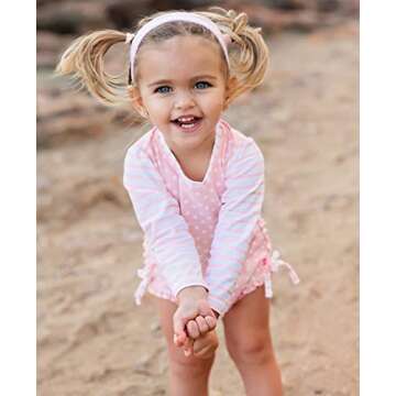 RuffleButts Baby Girls UPF 50+ Sun Protection Polka Dot Long Sleeve One Piece Rash Guard Swimsuit wi...