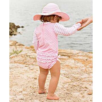 RuffleButts Baby Girls UPF 50+ Sun Protection Polka Dot Long Sleeve One Piece Rash Guard Swimsuit with Zipper - Pink Polka, 12-18m