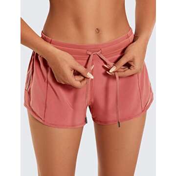 CRZ YOGA Athletic Shorts for Women with Zip Pocket, 2.5" Mid Waist Mesh Liner Shorts for Running Gym Workout Red Bronzer Small