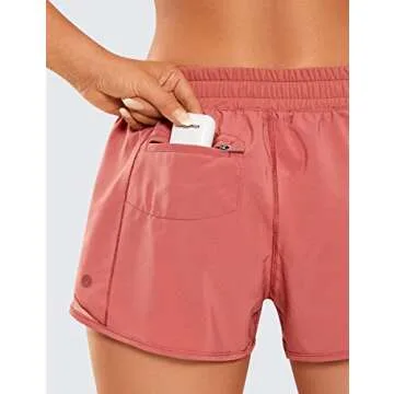 CRZ YOGA Athletic Shorts for Women with Zip Pocket, 2.5" Mid Waist Mesh Liner Shorts for Running Gym Workout Red Bronzer Small