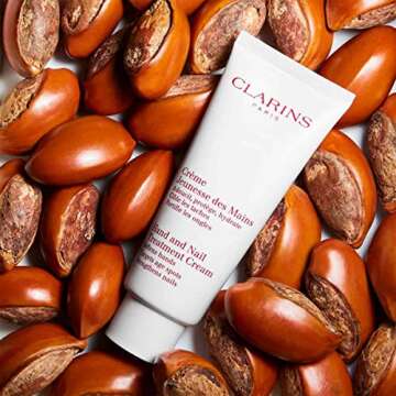 Clarins Hand and Nail Treatment Cream | Award-Winning | Softens, Nourishes and Shields Skin | Strengthens Nails and Conditions Cuticles | Natural Plant Extracts, Including Shea Butter | 3.4 Ounces