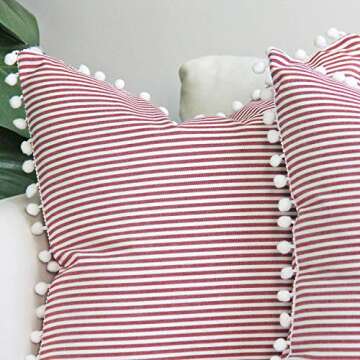 JOJUSIS Farmhouse Ticking Stripe Throw Pillow Covers with Pom-poms Red and White Outdoor Decorative Couch Pillowcases Cushion Covers Set of 2 20 x 20 Inch