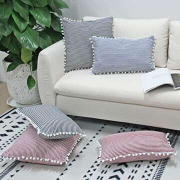 JOJUSIS Farmhouse Ticking Stripe Throw Pillow Covers with Pom-poms Red and White Outdoor Decorative Couch Pillowcases Cushion Covers Set of 2 20 x 20 Inch