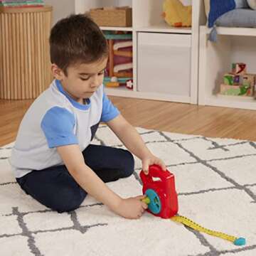 Battat – Toy Measuring Tape – Working Reel & Easy-Hold Handle – Tool Discovery Carousel – Metric & Imperial Units – 2 Years + – Big Tape Measure