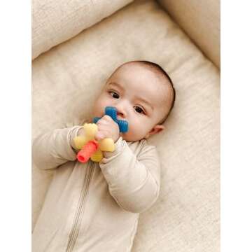 Itzy Ritzy Teensy Tube Teether; Textured Hollow Baby Teething Tube That Reaches Front Teeth & Back Molars, Made of Soft Silicone (Rainbow)